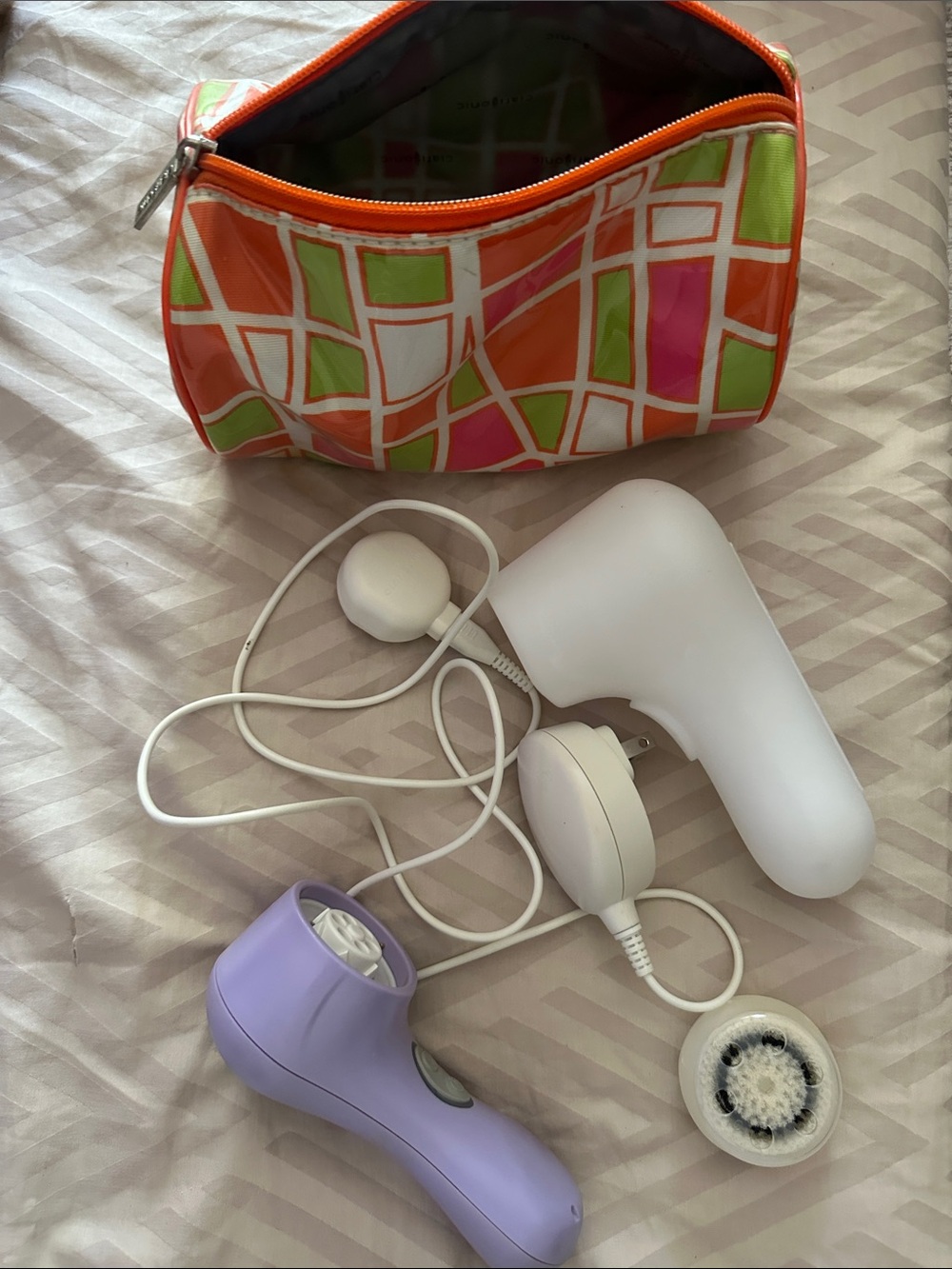 Clarisonic Purple and White Facial Cleansing Brush with Orange Multi-Color Pouch